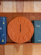 Embossed Numbered Clock in Terracotta
